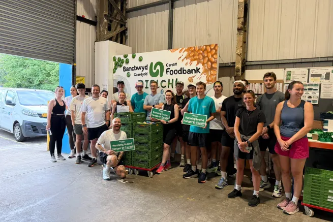 Liam Jones and OSA runners at the Cardiff Foodbank warehouse