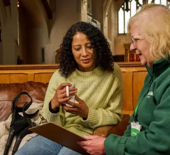 Woman getting advice from a food bank volunteer