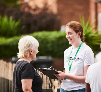 Woman collecting signatures on the street