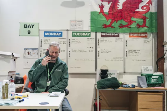 A man on the phone at the Cardiff food bank