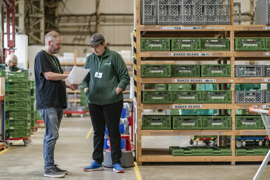 Foodbank volunteers and staff checking stock at the warehouse.