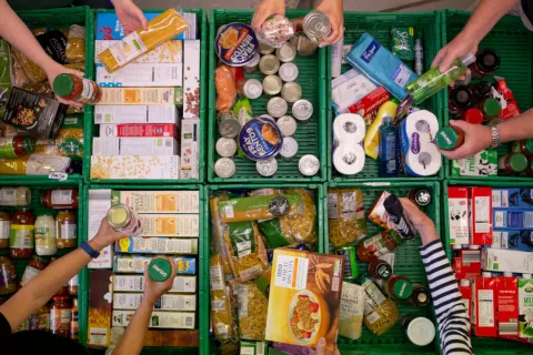 Boxes of donated food being sorted